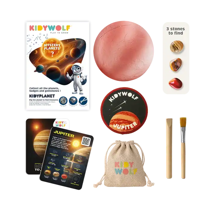 kidyplanet-mysterybox-inhoud Voorbeeldinhoud van een Kidywolf KIDYPLANET mysterybox met planeet, stenen, Jupiterbadge, kaart en graafgereedschap