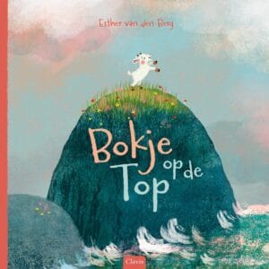Voorkant van Bokje op de top met het bokje op een hoge rots bij zee